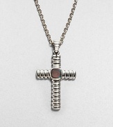 This classic, sterling silver cross pendant is adorned with labradorite, lending a touch of modern elegance.Sterling silverLabradoriteAbout 20 long; Pendant: about 1 x 1½ diam.Imported