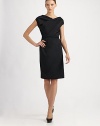 Chic and feminine, featuring an alluring twist-front neckline and a slim, detachable self belt.Jewel neckline with twist detailCap sleevesDetachable snap-close self beltAbout 24½ from natural waistCottonDry cleanMade in Italy of imported fabricModel shown is 5'10 (177cm) wearing US size 4. 