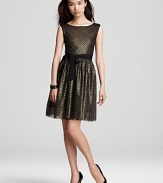 Metallic mesh shines on this Mark + James by Badgley Mischka dress, lending festive flair to the evening's events.