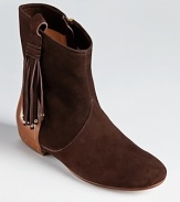 Flat out chic--Belle by Sigerson Morrison's Moore booties showcase both western and bohemian influences. Studded, fringed tassels at the side lend fashion flair.