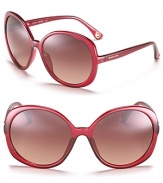 Round oversized sunglassses with red transparent frames for a sizzling style.