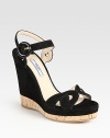 Suede design with a buckled ankle strap and cork sole.Self-covered wedge, 4¾ (120mm) Cork & suede platform, 1 (25mm) Compares to a 3¾ heel (95mm) Suede upperBuckled ankle strapLeather lining and solePadded insoleMade in ItalyOUR FIT MODEL RECOMMENDS ordering one half size up as this style runs small. 