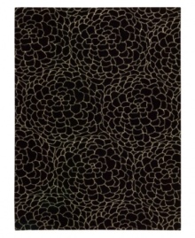 Silhouettes of swelling blossoms give this dark modern rug a striking character, woven from the highest quality New Zealand wool yarns. Offering an exceptionally dense and subtle texture, the Camilla presents a distinctive, abstract floral design in black and ivory colorways. Silhouettes of swelling blossoms give this dark modern rug a striking character, woven from the highest quality New Zealand wool yarns. Offering an exceptionally dense and subtle texture, the Camilla presents a distinctive, abstract floral design in black and ivory colorways.