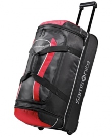 Stay on the move. This rolling duffel is crafted from a highly durable polyester and protected by end bumpers and bottom runners for a long-lasting presence that maneuvers trip after trip with incredible ease. The perfect size for last-minute getaways, this drop-bottom duffel features an easy-access exterior zip pocket and a spacious ready-to-pack interior. Stay on the move. This rolling duffel is crafted from a highly durable polyester and protected by end bumpers and bottom runners for a long-lasting presence that maneuvers trip after trip with incredible ease. The perfect size for last-minute getaways, this drop-bottom duffel features an easy-access exterior zip pocket and a spacious ready-to-pack interior.