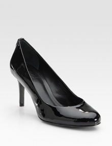 Glistening patent leather in a low-cut, round toe design with a goldtone designer emblem at the heel. Self-covered heel, 3 (75mm)Patent leather upperLeather liningBuffed leather solePadded insoleImportedOUR FIT MODEL RECOMMENDS ordering one size up as this style runs small. 