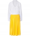Luxe dress in fine, pure silk - Soft, lightweight material drapes like a dream - Fashionably colorblocked in white and yellow with an elegant, matte sheen - Slightly billowed, button down top with v-neck, long sleeves and chest pockets - On-trend, gently pleated calf length skirt zips at side - Flattering slim silhouette tapers at waist - Elegant and ultra-chic, seamlessly transitions from work to weekend - Pair with peep toe pumps, wedges or sandals