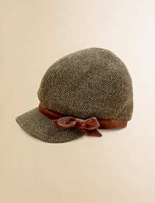 A classic newsboy cap is crafted from classic tweed for added warmth and accented with a velvet bow for an authentic look.Puffed, slightly slouchy crownStiff, rounded brimVelvet trimFloral-printed liningWoolHand washImported A classic newsboy cap is crafted from classic tweed for added warmth and accented with a velvet bow for an authentic look.Puffed, slightly slouchy crownStiff, rounded brimVelvet trimFloral-printed liningWoolHand washImported