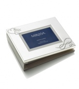 Tell a romantic tale. Loopy hearts in a radiant, silver-plated cover make Mikasa's Love Story photo album an elegant home for wedding pictures and other special memories.