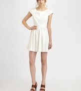 Light cotton jacquard, top-fitted with a full pleated skirt and skin-baring open back.BoatneckPleated cap sleevesBodice dartsWide waistbandCenter back zipperAbout 17 from natural waist66% cotton/34% nylonDry cleanImportedModel shown is 5'9½ (175cm) wearing US size 4.