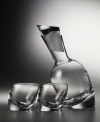 Add a dash of style to your bar with the Tilt decanter set. The unique, slanted design will lend sophistication to all of your entertaining events. Includes two double old-fashioned glasses.