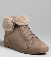 Eileen takes her minimal style into the season's must-have fashion sneakers, with plush, foldover shearling cuffs that add a cozy touch.