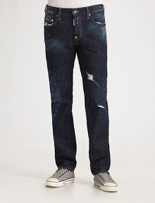 EXCLUSIVELY OURS. Rips, whiskers and tears give a dark-washed classic the look of a workman's favorite, now cut with a classic, straight-leg fit. Five-pocket style Leather patch on back pocket Inseam, about 32 Cotton; machine wash Made in Italy 