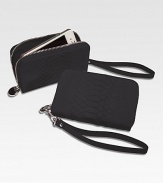 Trim and elegant, this zip-around design of python-embossed leather is just the right size to hold your phone, a credit card, a little cash and a key or two, so it's perfect for a pared-down night on the town.ul> HandcraftedZip-around designDetachable wrist strapCell phone pocketTwo inside card slotsInside currency pocketInside zip change pocket5½L X 3¼WImported