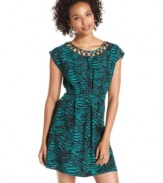 A neckline of cutouts accents this zebra-print dress with trend-right style! For a look that's chic by day, pair the a-line frock with sandals and your prettiest accessories!
