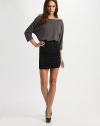 A blouson bodice and two-tone palette convey a look of effortless chic that easily dresses up for a night out on the town.BoatneckDropped shouldersThree-quarter sleevesBlouson bodiceRuched fitted skirtCenter back zipper About 24 from natural waistBodice: wool; skirt: rayonDry cleanImportedModel shown is 5'9 (175cm) wearing US size 4.