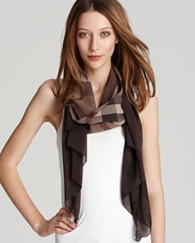 A large check pattern and earthy tones make this lightweight scarf a must-have this spring. A large check pattern and earthy tones make this lightweight scarf a must-have this spring.