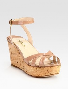 Patent leather adjustable ankle strap design with a cork wedge. Cork wedge, 3 (75mm)Cork platform, 1 (25mm)Compares to a 2 heel (50mm)Patent leather upperLeather lining and solePadded insoleMade in ItalyOUR FIT MODEL RECOMMENDS ordering true size. 