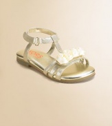Glistening metallic straps are sweetly adorned with satin rosettes in this graceful T-strap design.Metallic fabric upperSatin grosgrain rosettesGrip-tape close ankle strapPadded insoleComposite rubber soleMetallic faux leather liningImported