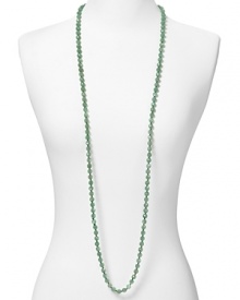 Simple and versatile. This extra-long beaded strand from Carolee adds a dash of color to your neckline, crafted of adventurine stones.