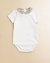 A Peter Pan collar of woven checks sweetly trims a simple bodysuit of soft cotton knit.Woven Peter Pan collarShort sleevesBack button closeSnap bottomCottonMachine washImported Please note: Number of buttons may vary depending on size ordered. 