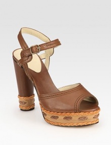 Intricately stitched leather platform with braided leather trim and an adjustable ankle strap. Self-covered heel, 4½ (115mm)Stitched leather platform, 1 (25mm)Compares to a 3½ heel (90mm)Leather upperLeather lining and solePadded insoleMade in ItalyOUR FIT MODEL RECOMMENDS ordering true size. 