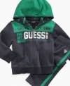 Keep him motivated to move in this comfortable hoodie and pant set from Guess.