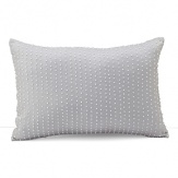 A glamorous decorative pillow, accented with rows of iridescent, pearl-like seed beads.