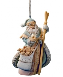 Adorned in traditional garb, Santa's Greatest Gift ornament sits upon your Christmas tree with Santa holding his magical snow globe and bag of treasures. Crystal embellishments add a touch of sparkle.