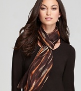 A light breeze enlivens the blurred print atop this Eileen Fisher scarf for a chic style statement.