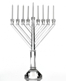Introduce the resplendent grace of faceted crystal to your Hanukkah tradition with this stately menorah from Lighting by Design. At over a foot high and with sparkling cut detail, it brings new attention to the Festival of Lights. Introduce the resplendent grace of faceted crystal to your Hanukkah tradition with this stately menorah from Lighting by Design. At over a foot high and with sparkling cut detail, it brings new attention to the Festival of Lights.