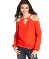 Elevate your casual look with this top from Rampage! A chic array of cutouts lend infinite style to this smocked design.