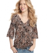 Incorporate a wild design into your stock of cool tops with this snakeskin-print style from American Rag!