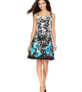 This pretty petite dress by Nine West features a classic A-line silhouette adorned with a black-and-white floral print and a bright-hued poppy print toward the hem.