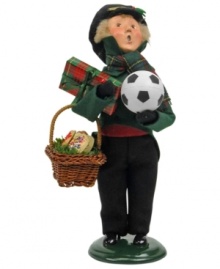 A young boy stocks up on treats and toys for a merry holiday, all while singing beloved holiday carols. An adorable figurine from the Bearing Gifts family, with the handcrafted charm of Byers' Choice. A young boy stocks up on treats and toys for a merry holiday, all while singing beloved holiday carols. An adorable figurine from the Bearing Gifts family, with the handcrafted charm of Byers' Choice.