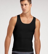 The classic crew is redefined in high-stretch cotton that firms the chest as it flattens the stomach. Crewneck Improves posture Supports lower back No bulk under clothing Tapered shape 81% cotton/19% spandex; machine wash Imported 