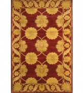 A golden vine-and-floral motif creates exquisite contrast against a deep maroon ground, adding fine finesse to this plush area rug from Safavieh. Tufted in India from pure wool, this rug evokes classic Persian designs in a bold, bright color palette for the contemporary home. (Clearance)
