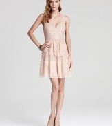 With delicate tiered lace, BCBGMAXAZRIA's neutral-hued dress lends a soft, vintage-inspired look.