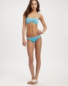 An eye-catching print meets gorgeous color giving this stretch style with convenient removable straps, must-have appeal.Twist bandeau topRemovable strapsRuched detailsFully lined91% nylon/9% spandexMachine washImported Please note: Bikini bottom sold separately. 