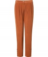 Inject a note of rich color into your favorite daytime staples with Antik Batiks rust silk pants, tailored to perfection for all-season sophistication - Button closure, side slit pockets, pleated front, buttoned ankles - Pair with breezy tops and blazers