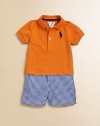 A classically preppy set includes a cotton mesh polo, gingham short and coordinated madras ribbon belt. Shirt Ribbed collarShort sleevesFront buttonsEven vented hem Shorts Front buttonZip flyRear elasticized waist with belt loops and grosgrain beltOpen hand pocketsBack welt pocketCottonMachine washImported Please note: Number of buttons/snaps may vary depending on size ordered. Additional InformationKid's Apparel Size Guide 