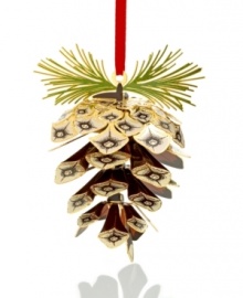 A relic of your tree's past, this pine cone ornament captures the intricacies of nature in gold-plated brass. Finished with tufted pine needles, it fits right into its surroundings. A relic of your tree's past, this pine cone ornament captures the intricacies of nature in gold-plated brass. Finished with tufted pine needles, it fits right into its surroundings.
