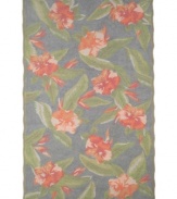 Blissfully exotic: The Tommy Bahama Hibiscus Bliss rug brings a lush, tropical feel to any indoor or outdoor space. Durable, fade-resistant fibers are hand-hooked to create a richly layered surface, making the rug a perfect accent in any high-traffic area. Hose off for easy cleaning.