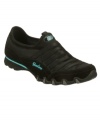 Stretch your sneaker's versatility with the Bikers Fixation design by Skechers. A monochromatic design gets edge from contrast logo accents and bungee lacing for easy on and off.