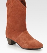 Rich leather trim finishes this western-inspired shape of fine suede. Stacked heel, 1¾ (45mm)Shaft, 9¾Leg circumference, 12Suede upper with leather trimLeather liningLeather and rubber solePadded insoleImportedOUR FIT MODEL RECOMMENDS ordering one half size up as this style runs small. 