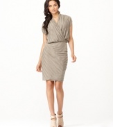 Accordion pleats and a paneled style create a sophisticated look on this pretty party dress from RACHEL Rachel Roy.