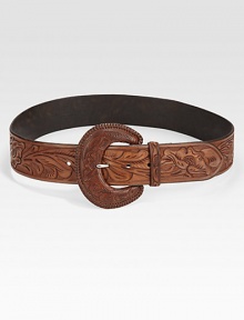 An oversized buckle and intricately designed leather give this belt rustic charm. About 2 wideLeatherImported An oversized buckle and intricately designed leather give this belt rustic charm. About 2 wideLeatherImported