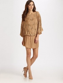 Hand-beaded sequins sparkle across this gorgeous blouson shift.BoatneckDropped shouldersDolman sleevesBlouson bodiceDrawstring waistAbout 36 from shoulder to hemViscoseDry cleanImported