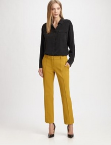 Restore your work wardrobe with these pleated jersey pants, defined by four-pocket styling and a medium rise. Button closureZip flyBack besom pocketsRise, about 8½Inseam, about 27PolyamideDry cleanImportedModel shown is 5'9 (175cm) wearing US size 4.OUR FIT MODEL RECOMMENDS ordering true size. 