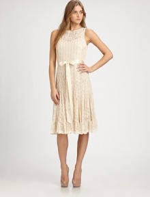 Delicate allover pintucks shape this feminine lace design.Jewel necklineSleevelessRibbon sashConcealed back zip with keyhole button closuresAbout 26 from natural waist65% rayon/35% nylonDry cleanImportedModel shown is 5'10 (177cm) wearing US size 4. 