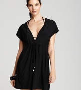 In a draped silhouette with a hood, Magicsuit's solid cover up will add instant attitude to your on-vacation look. This dress feels low-key chic with flat sandals and oversized frames.
